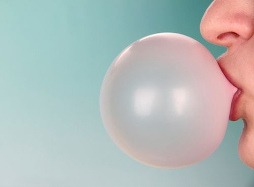 bubble gum being blown into a bubble