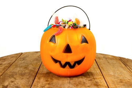 trick or treat pumpkin filled with candy