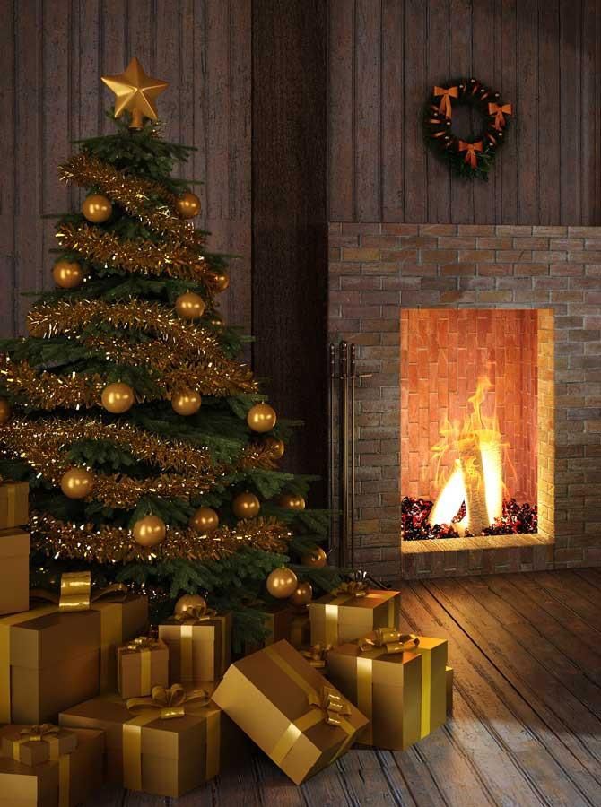 christmas tree and presents next to a fireplace
