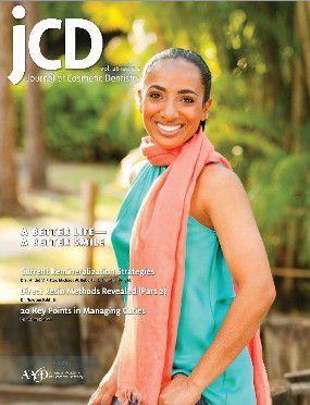 Woman in a teal dress and pink scarf smiling beautifully on the cover of a magazine